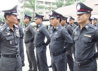 Lt. Gen. Wibun Bangthamai (left) inspects the force at the Chonburi Immigration office in Jomtien.